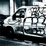 A VW Transporter covered with graffiti in Paris.